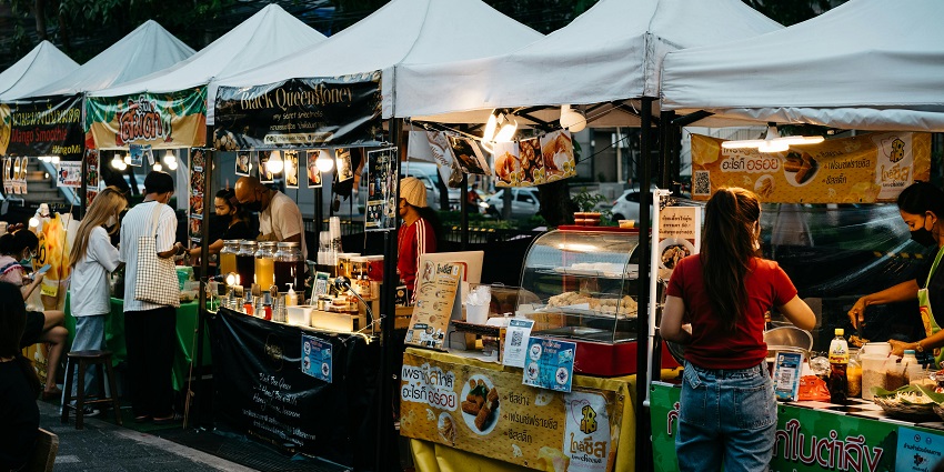 A market in Thailand offering affordable fashion, handmade item, and delicious food option