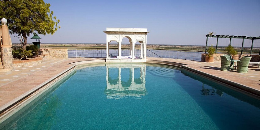 Sardar Samand lake with lush greenery and open skies, providing a refreshing escape.