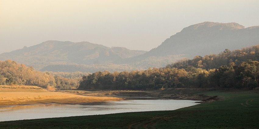 An image of a serene river winding through a valley in the Satpura Tiger Reserve