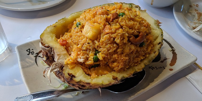 Pineapple fried rice served in a hollowed-out pineapple at Banana Leaf in Savoey Restaurant