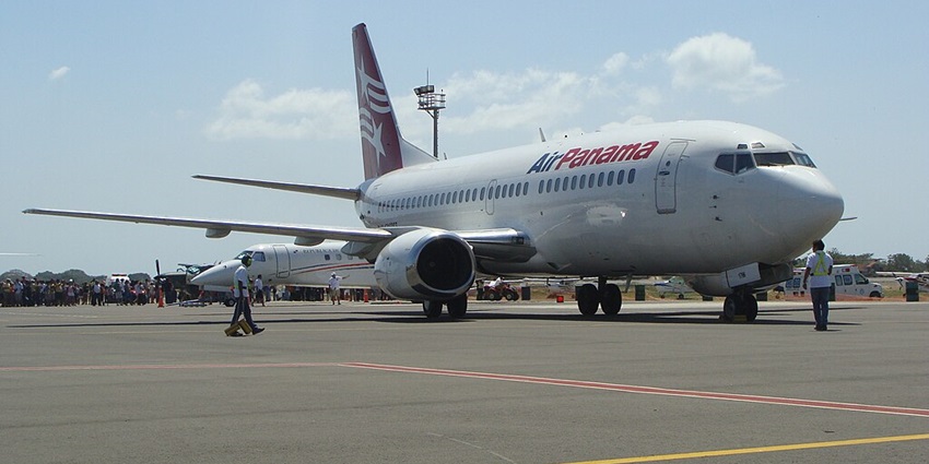 Air Panama Boeing parked with a crowd in the background at an airport in Panama
