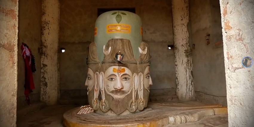Shiva statue in the region of Nepal, a sacred spot, draws devotees and tourists alike.