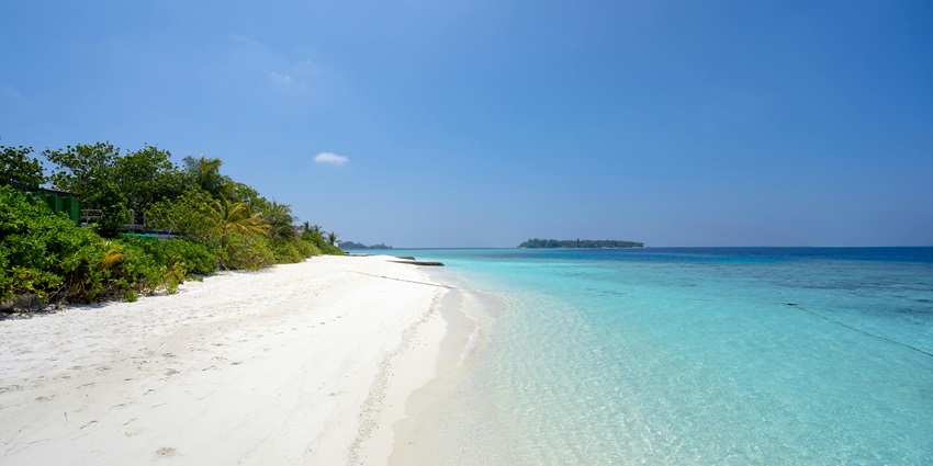 Enjoy a scenic coastal walk and peaceful ambience at Segara Ayu Beach in Indonesia.