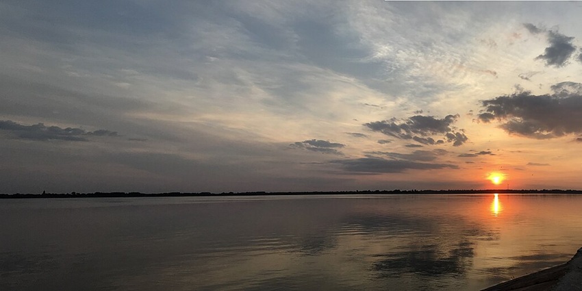 Naya Raipur Lake with a large water body separated by roads, greenery and structures