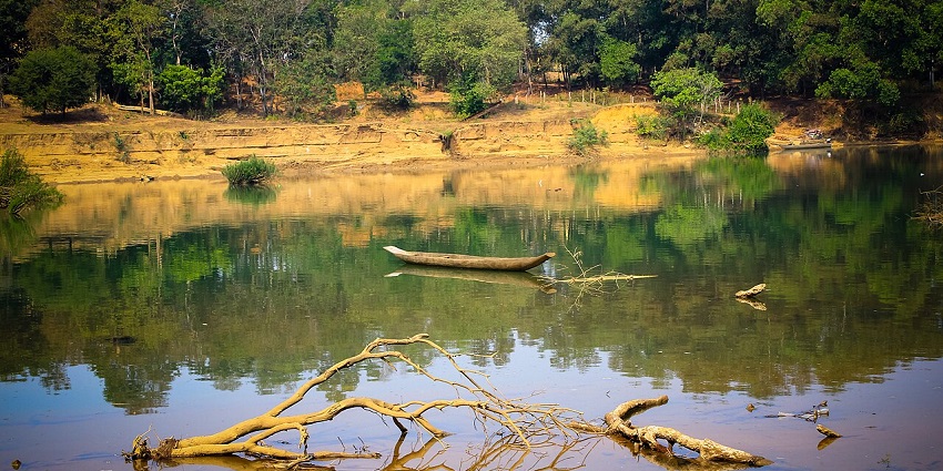 An image of the Serepok River in Vietnam, with calm waters winding through lush green landscapes