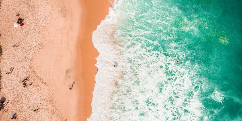Take a peaceful beach walk along Seseh Beach, surrounded by lush nature.