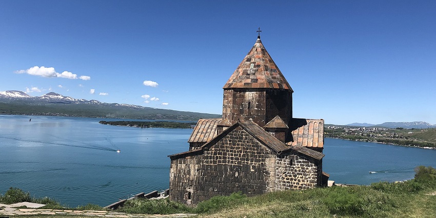 A historic Armenian monastery perched on a peninsula with panoramic views of Lake Sevan.