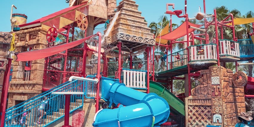 Tourists swimming together in a pool on a sunny day at the Shakariya Water Park