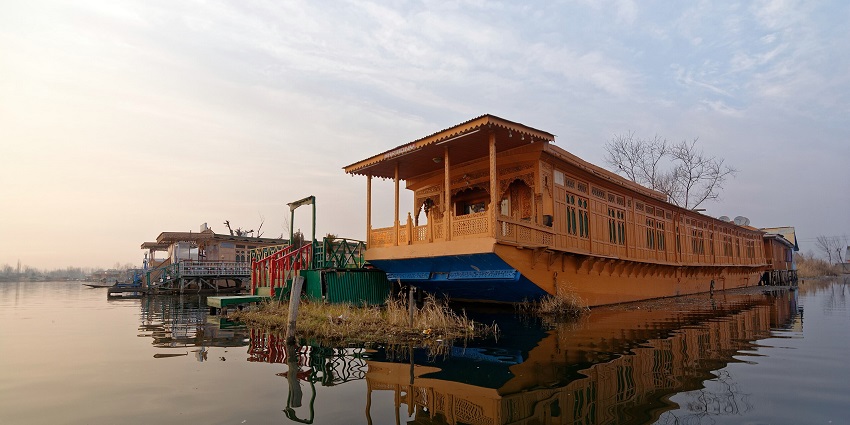 An image of one of the best houseboats in Nigeen Lake with multiple windows and stairs.