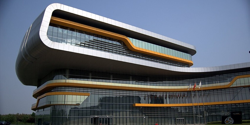 An image showing the exterior view of the Shanghai Automobile Museum with its architectural design.