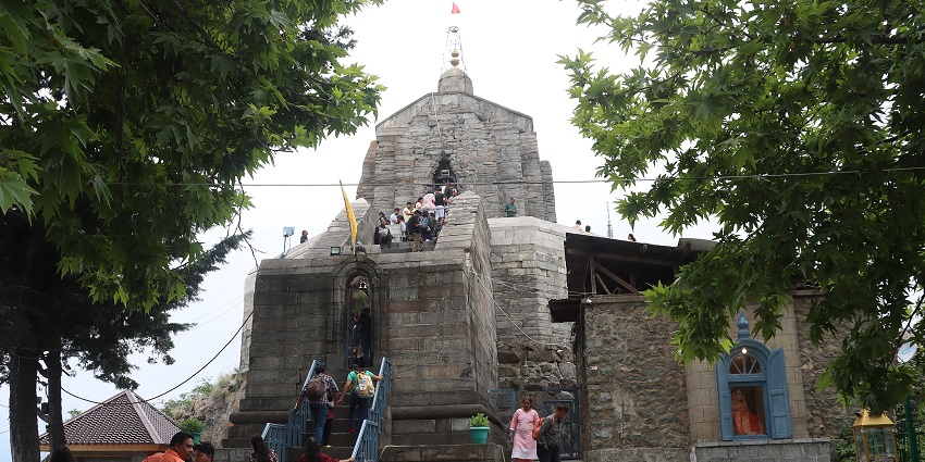Shankaracharya temple with devotees climbing up the stairs and traditional architecture