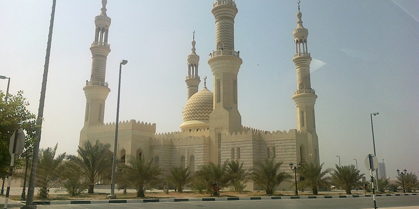 Admire the grand architecture of the Sheikh Zayed Mosque in Ajman