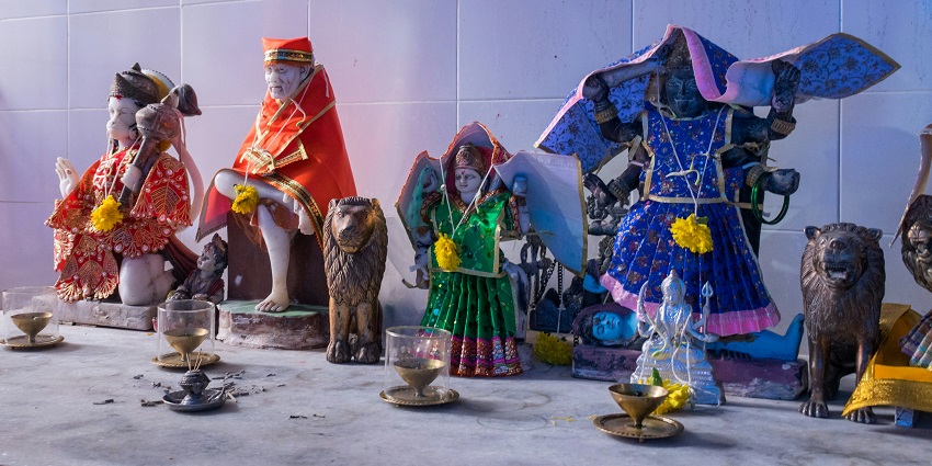 A picture of a mandapam at a Sai Baba temple in Faridabad with statues of deities