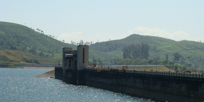 An image showing a view of Sholayar Dam, one of the best places to visit near Birla Waterfalls.