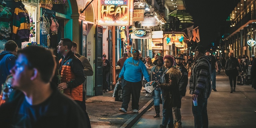 An image showing a busy street market at night, with vendors and shoppers, like Tay Do Night Market.