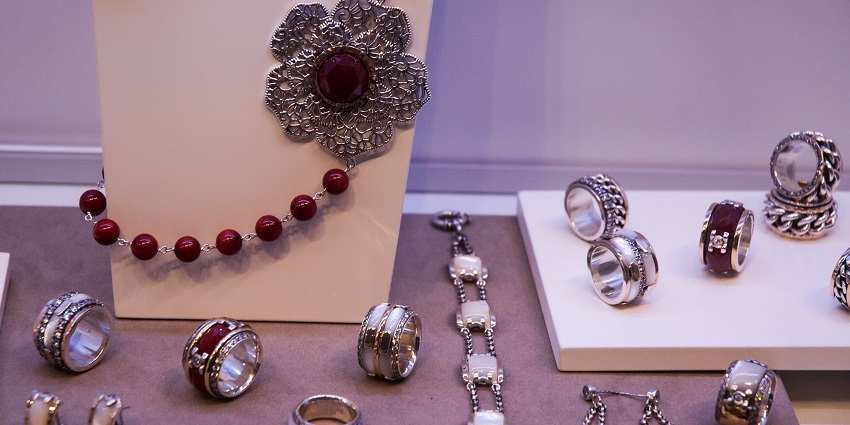An image of elegant handcrafted silver jewellery with intricate and unique designs.