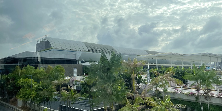 A view of the exterior of the best airport in the world in Singapore during a cloudy day.