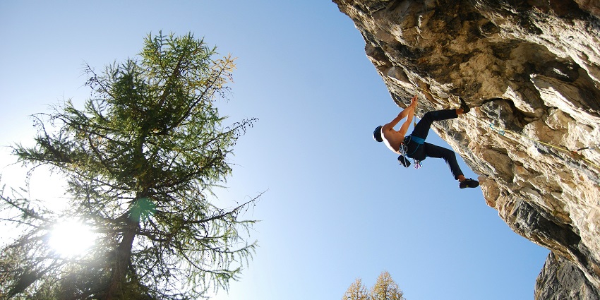 Image of a climber ascending the rugged rocks of Siurana in Spain
