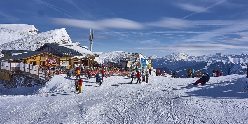 View of the pristine slopes in the breathtaking Swiss Alps, surrounded by snow-covered peaks