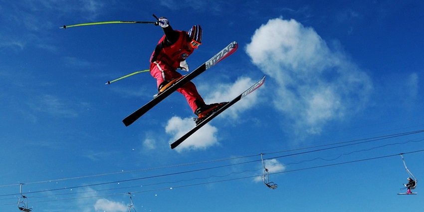An image of thrilling winter sports on snow-covered slopes in breathtaking mountains.