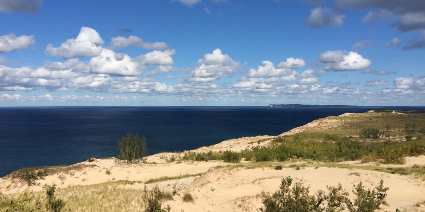 Sleeping Bear Dunes National Lakeshore with a large water body and sandy shoreline.