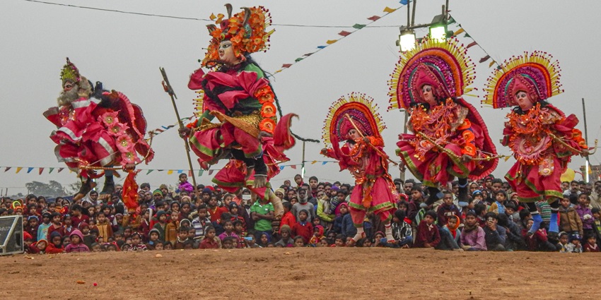 Image of beautiful dancers at Sohrai celebrations, dressed in colorful costumes.