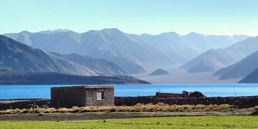 Spangmik village with green plains, Pangong Tso Lake and sandy mountains at a distance
Viewers of this file can see comments and suggestions