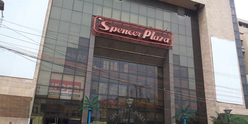 An image showing the modern exterior of Spencer Plaza, the first shopping mall in India.