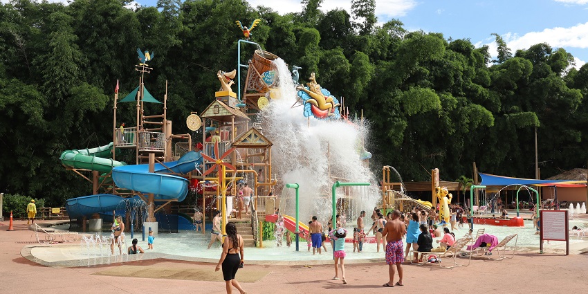 A view of a vibrant water park featuring various slides, pools, and attractions.