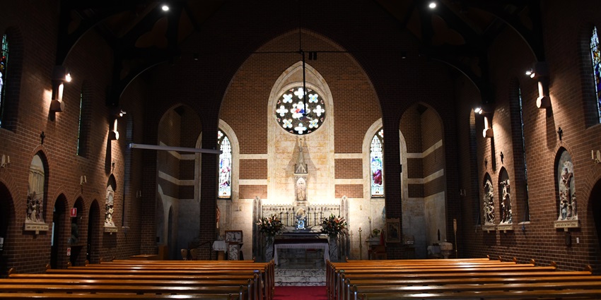 Empty St. Mark's Church with intricate architecture and soft light filtering through