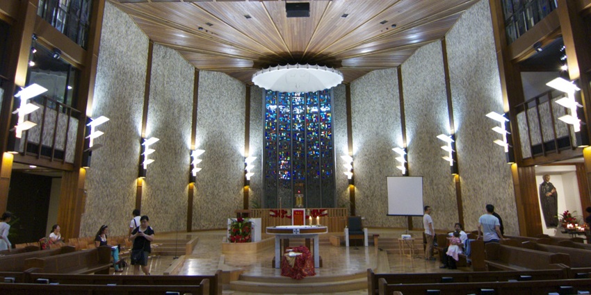 St. Peter Julian's Church interior with intricate design and a peaceful ambience, and visitors inside