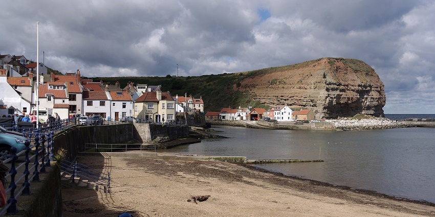 Staithes Beach, known for pollution concerns, remains a picturesque village with a maritime history.