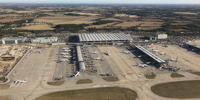 View of London Stansted Airport, showing terminal buildings and extensive runways.