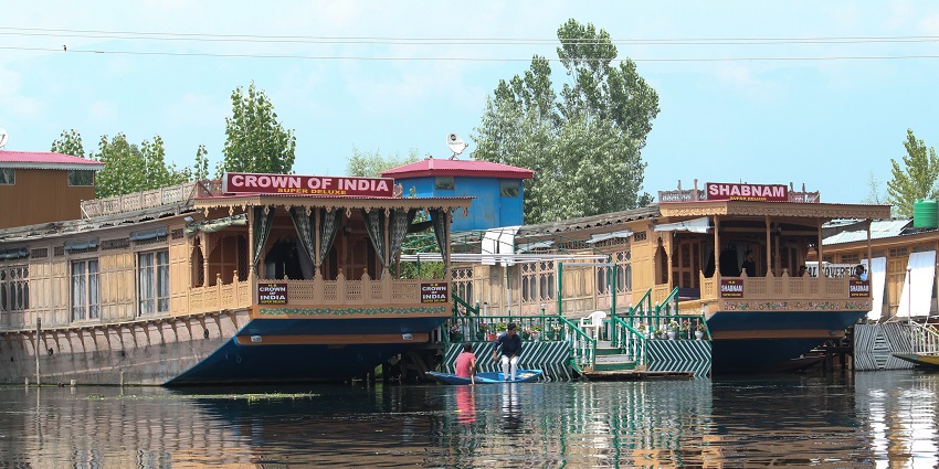 A picture of a warm, traditional Kashmiri houseboat on Dal Lake in December
