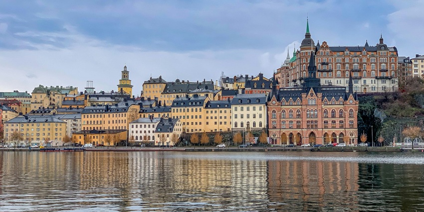 Places to visit in Europe in August include a city spread across islands, featuring charming old town streets and scenic waterfronts