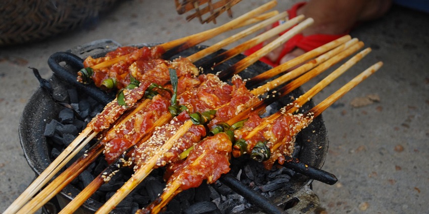Make sure to relish the authentic Vietnamese street food at the Hoi An night market.