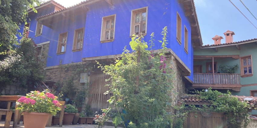 An image of a blue house in Cumalıkızık village, Bursa, Turkey, showcasing its historic charm, highlighting things to do in Bursa.