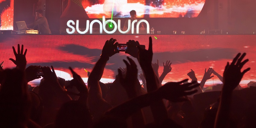 An image of Sunburn Goa with a crowd, and colourful lights, one of the best music festivals in India.