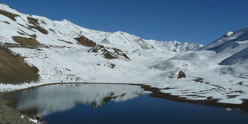 One of the tallest lakes in Himachal, stunning Suraj Tal, set between the rugged mountain landscapes