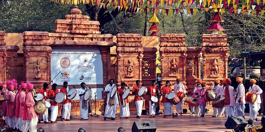 An image of the vibrant Surajkund International Crafts Mela festival with colourful displays.