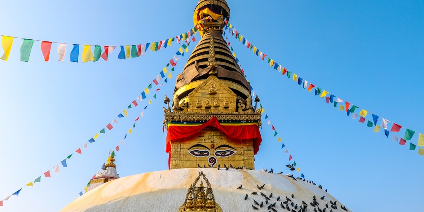 A glimpse of the pristine white shrines of Swayambhunath Temple with spiritual charm.