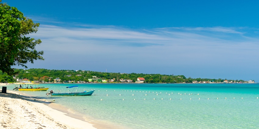 Seven Mile Beach, Grand Cayman, with clear turquoise waters and golden sandy shore
