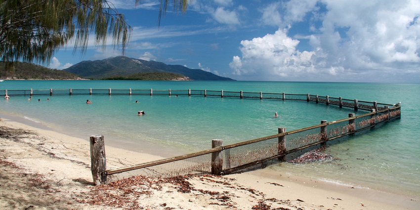A picture of a swimming enclosure at a beach in Sri Lanka with turquoise waters and golden sand