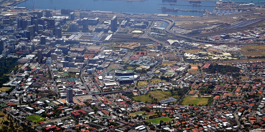 A view of the city of Cape Town and Table Mountain, featuring a bustling harbour.