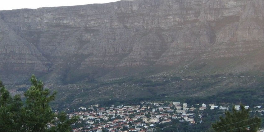 Table Mountain in Cape Town, with its flat top, cliffs, and scattered housing below.