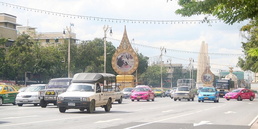Tourist group visiting the old places surrounding Democracy Monument, Bangkok.