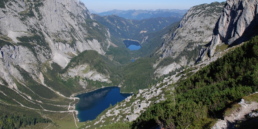 Gosau Lake surrounded by pine forests and mountains reflects the beauty of Austria in winter