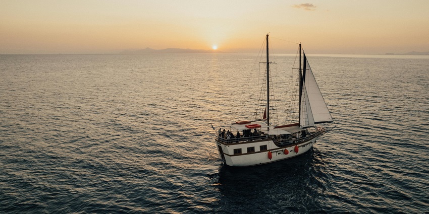 Sail across calm waters on a traditional dhow boat, one of the top things to do in Tofo, Mozambique