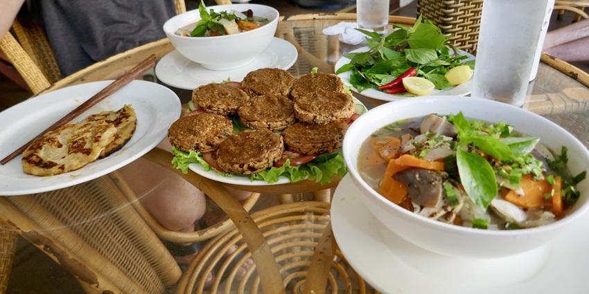 A picture of a traditionally cooked Vietnamese meal served on a table at a restaurant