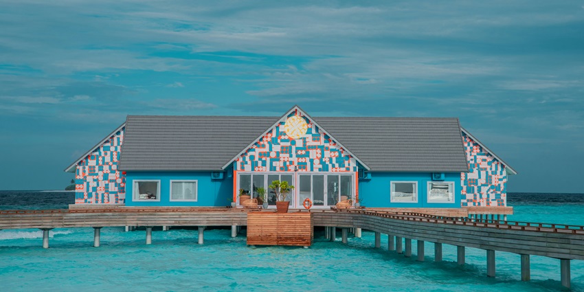 A picture of a traditional Maldives spa centre from the outside with tranquil waters surrounding it